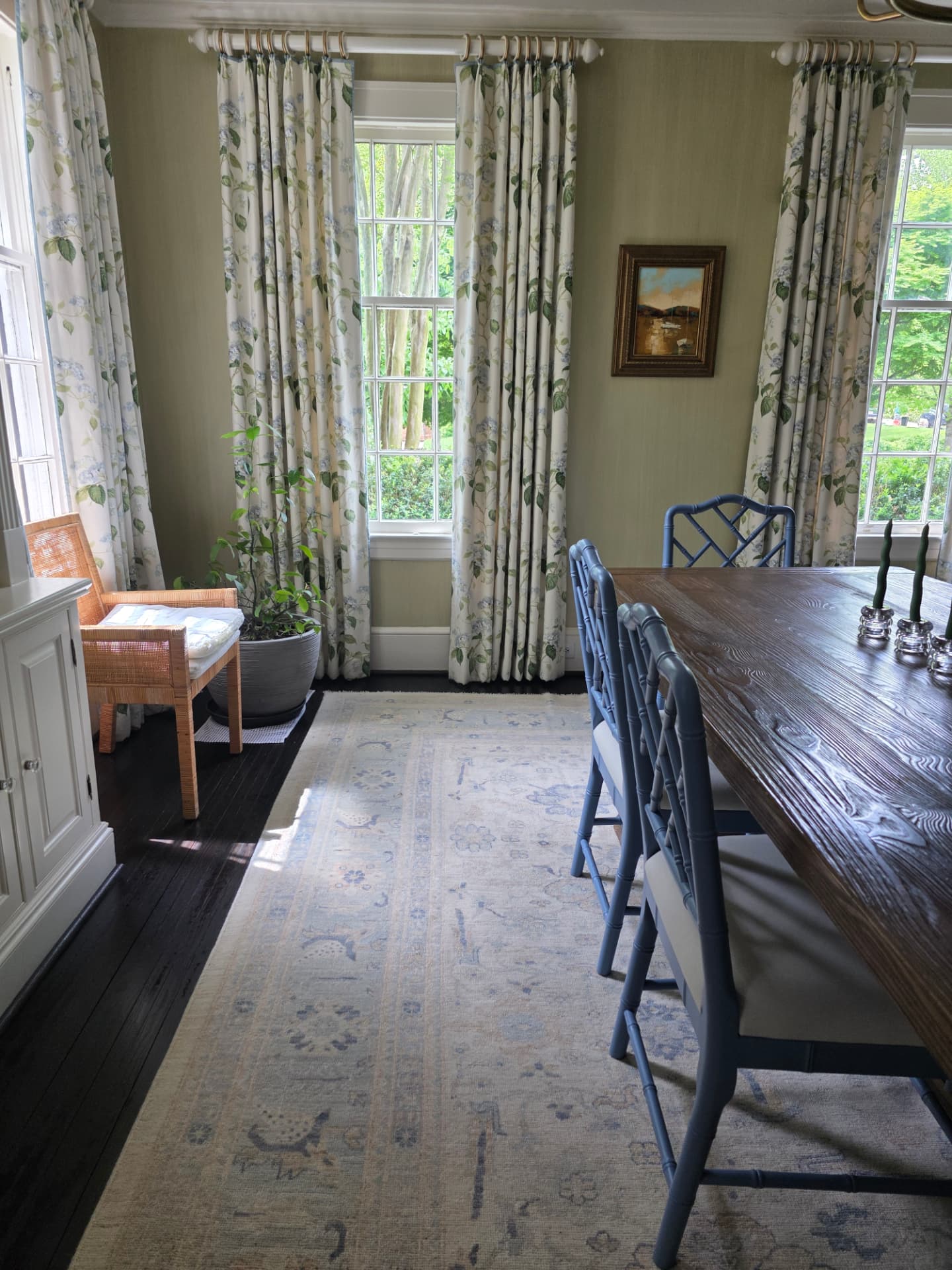 Dining room with a dusted wood table and clean hardwood floors